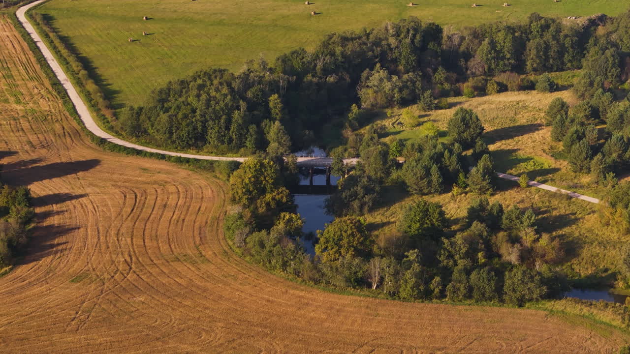 Bridge Over Tebra River With Countryside Fields. - aerial shot