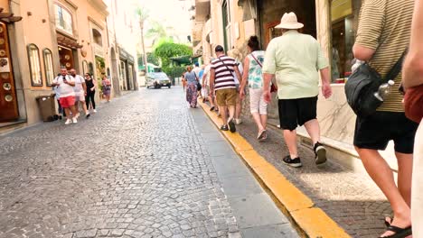 tourists walking through sorrento's charming streets