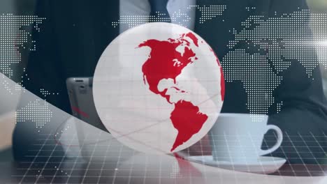 Animation-of-red-and-white-globe-and-map,-over-businessman-using-tablet