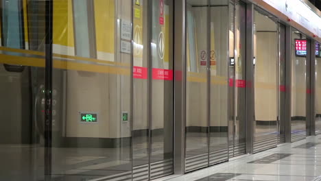 mta subway train entering coming leaving station track platform and opening the door