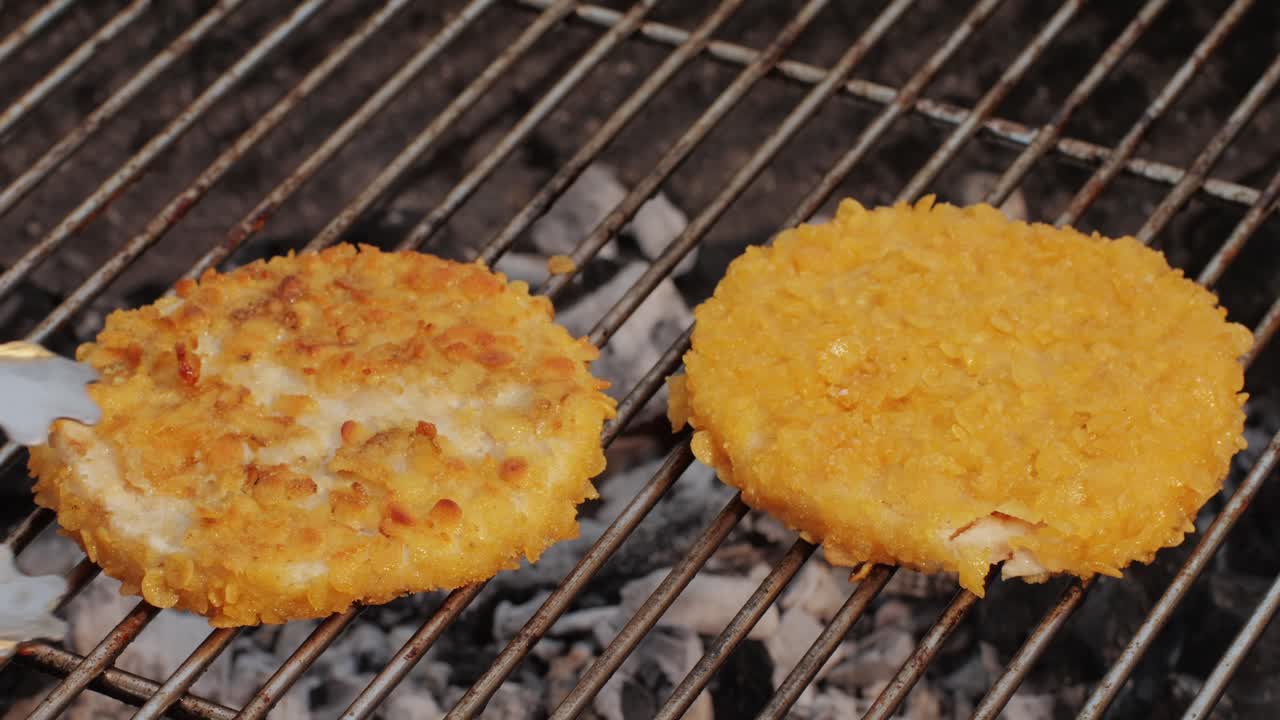 Veggie orange burger on grill, carrot and oats burger with corn and yellow pepper, vegetarian food barbeque, potato grill burger.