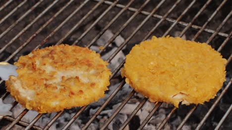 veggie orange burger on grill, carrot and oats burger with corn and yellow pepper, vegetarian food barbeque, potato grill burger.