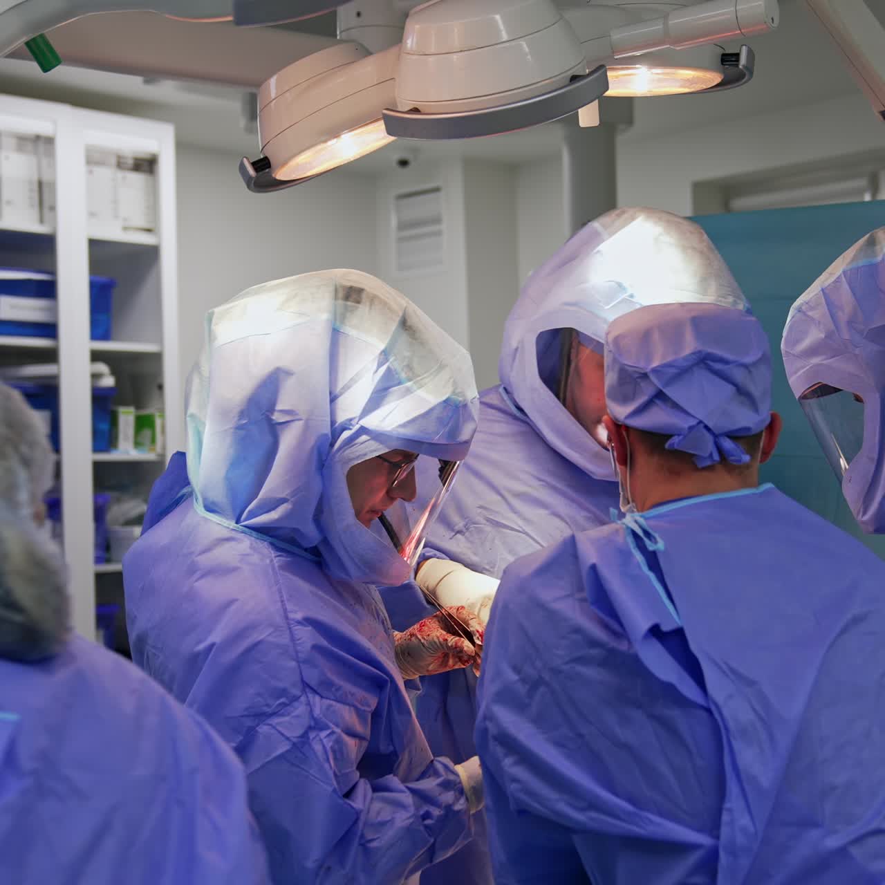 Modern surgical room with operation in process. Endoprosthetic surgery conducted by the professional team of medics