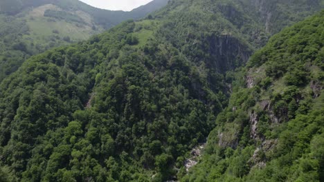 hermit shelter in remote forested mountains, white church in livo valley