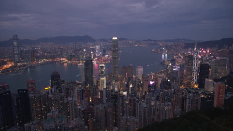 day to night timelapse of hong kong cityscape from peak view