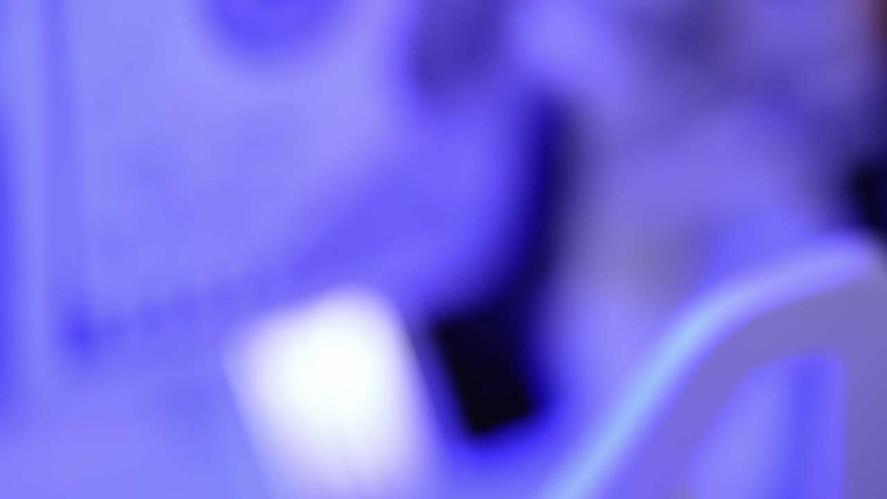 100 US dollar in money counting machine in action, close up. Money counting equipment for paper money calculation.