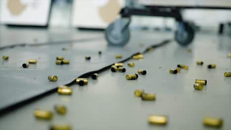 spent gun cartridges on shooting range floor