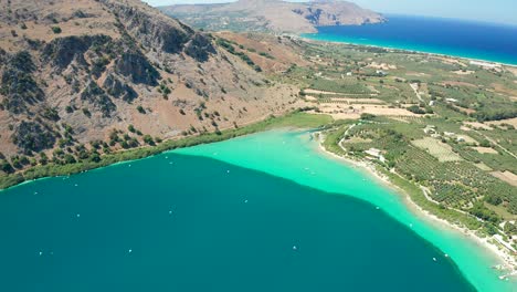 view from above beautiful scenic lake kournas, deep blue and turquoise water, crete island