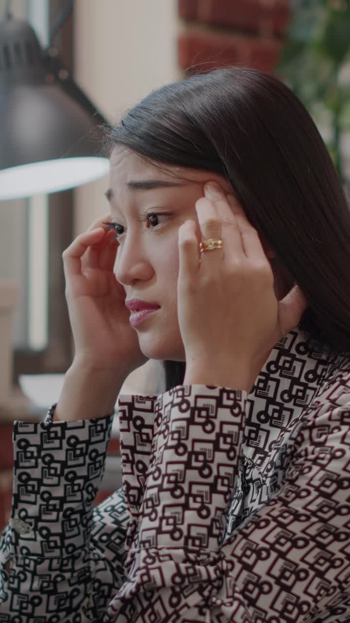 Stressed Asian Businesswoman in Office