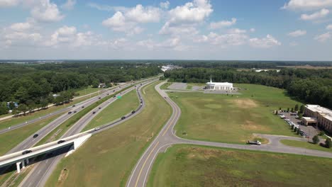 An-aerial-view-of-several-roads-divided-by-green-grass-on-a-beautiful-day