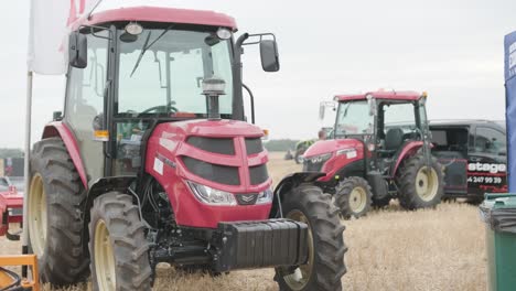 demonstration of agricultural machinery at an exhibition. tractors operate in the field, showcasing their capabilities and performance in action