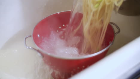 pastas being drained in the sink