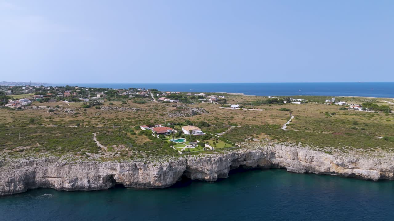Pan shot of beautiful Costa Blanca Plemmirio in Sicilia with never ending seascape at background