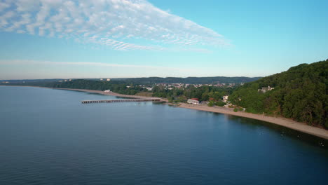 aerial view of gdynia orlowo sea coast and pier molo on summer day, poland