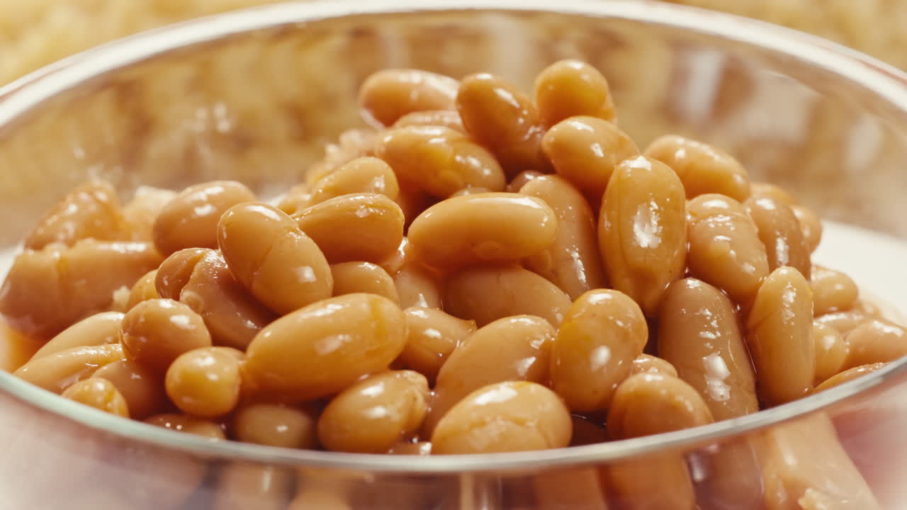 Canned red bans preserved beans rotating background close up side view. Organic steamed beans. Pickled bean for a Mexican dish