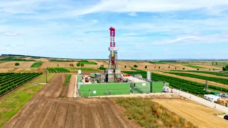 aerial view of land oil drilling rig in austria at daytime - drone shot