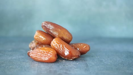 close up of dates on a blue surface