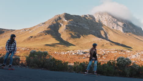 happy-multi-ethnic-friends-longboarding-together-cruising-downhill-on-beautiful-countryside-road-having-fun-skating-hanging-out-enjoying-relaxed-summer-vacation-slow-motion