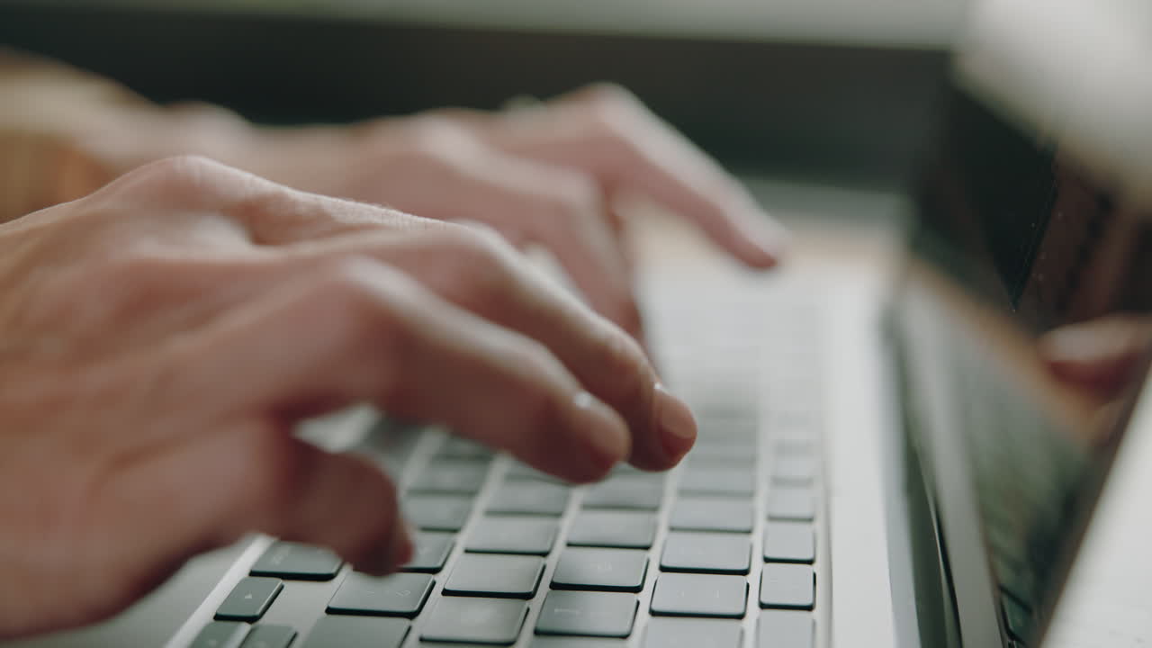 Typing on a laptop