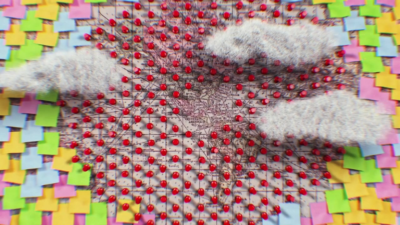 Stop Motion Animation of Sticky Notes and Pins Covering a Vintage World Map