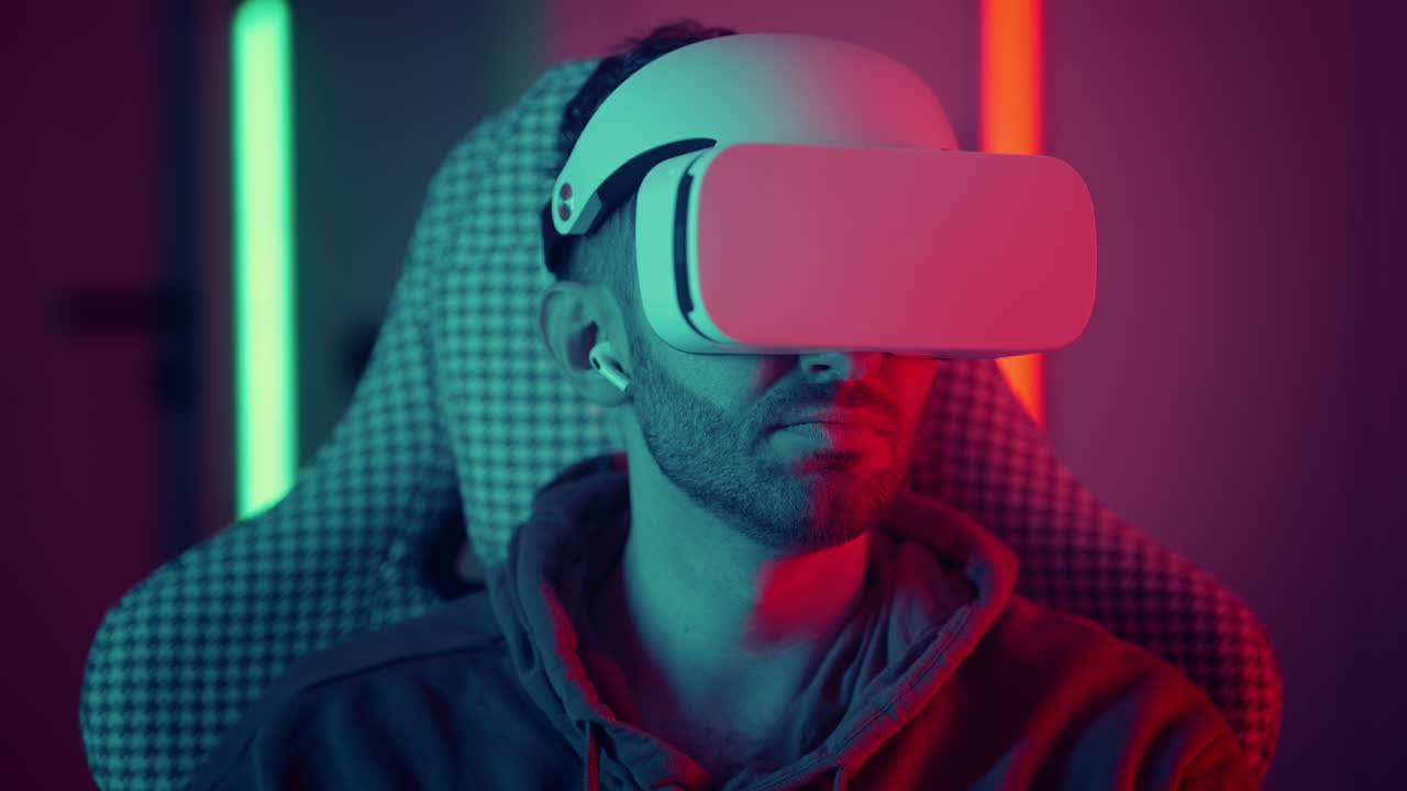 Man watching movie using virtual reality glasses. man makes swiping and touching moves with hands playing VR game. High quality 4k footage