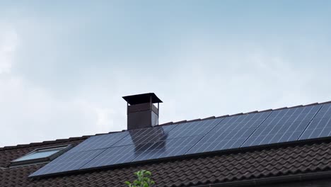 solar panels on a rooftop under a cloudy sky, symbolizing clean energy timelapse