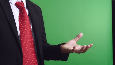 businessman offering gesture on green screen