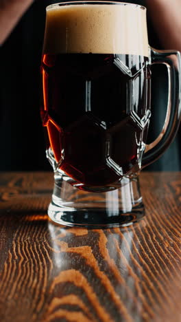 dark beer in a glass mug