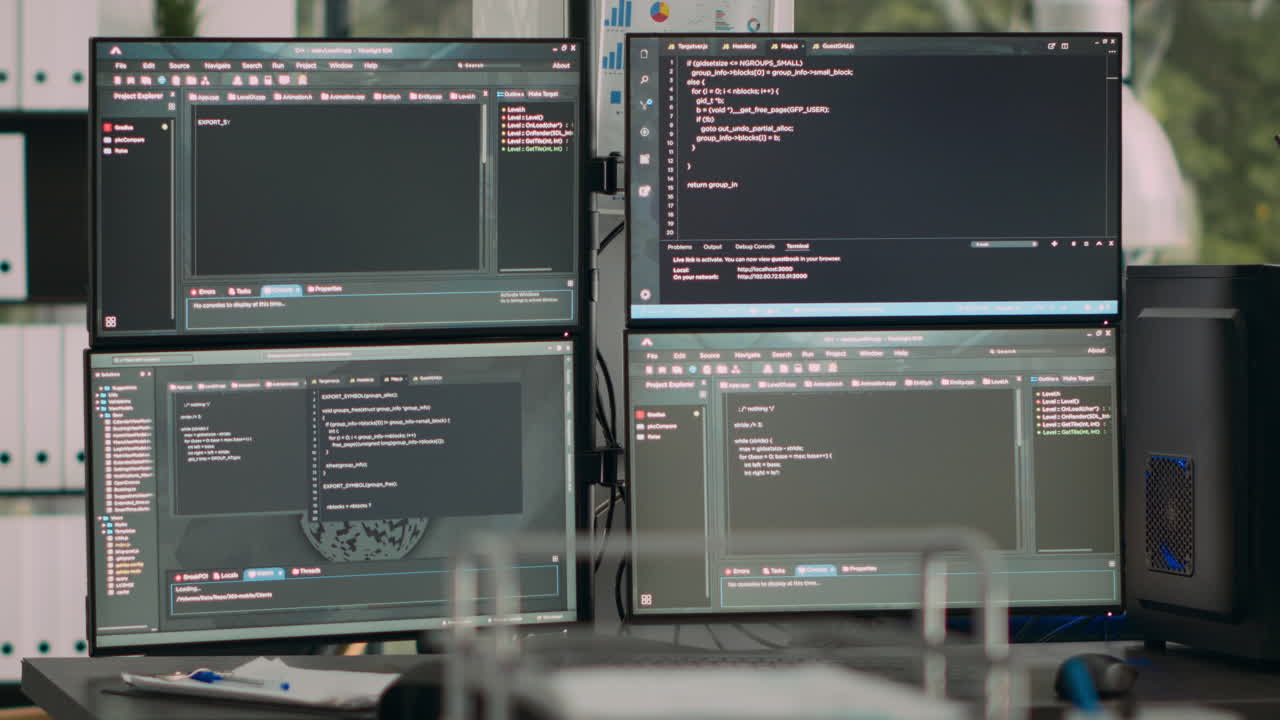 Monitors displaying parsing code in empty it agency office desk with computers