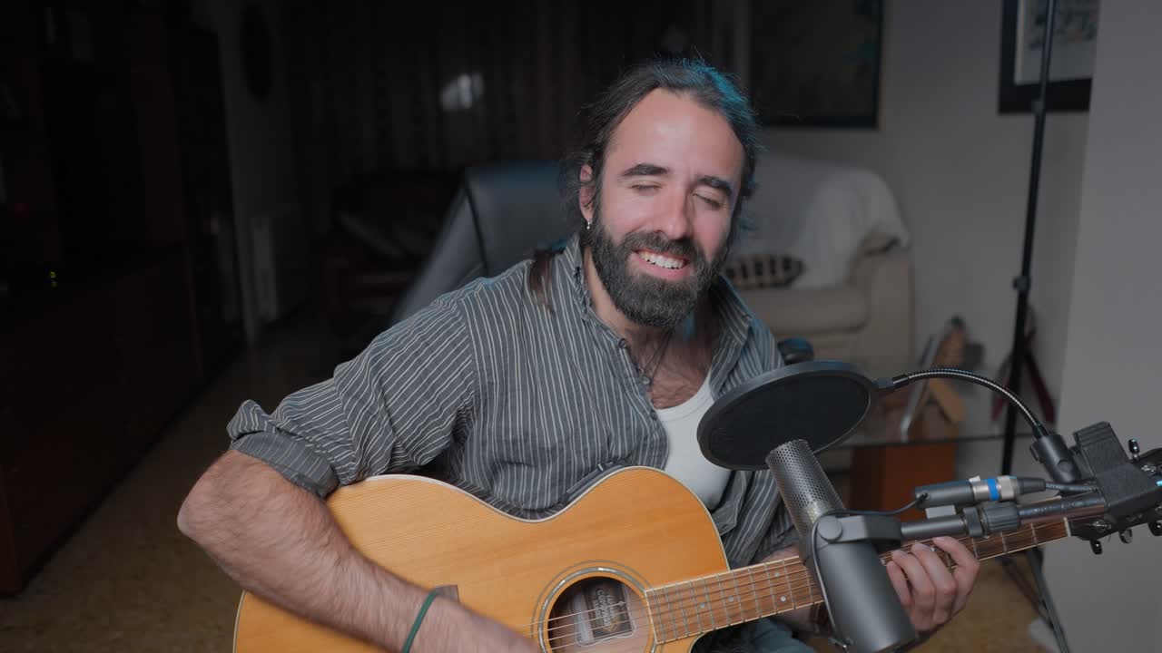 Man Playing Acoustic Guitar and Singing