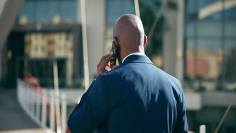 businessman talking on phone in city