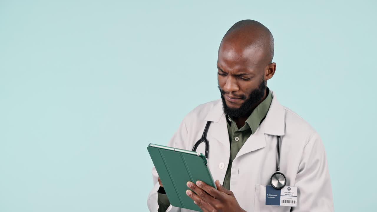 Tablet, thinking and man doctor in a studio doing