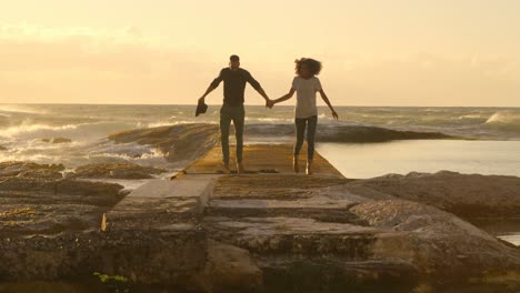 Couple-having-fun-on-the-beach-4k