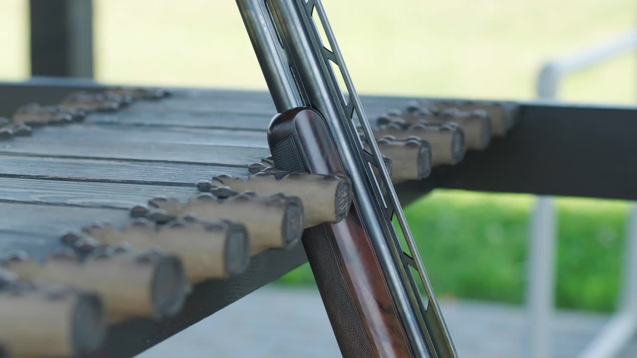 Hunting rifle and bullets. Shotgun. Close-up. Sport shooting from a gun in a shooting range.