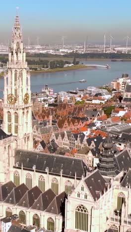 aerial view of the cathedral of our lady in antwerp, belgium, showcasing its intricate architecture and dominance over the cityscape. vertical video
