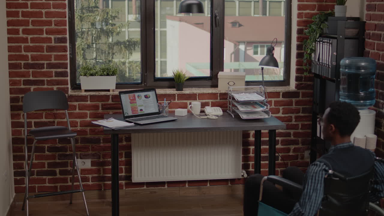 Consultant in wheelchair working on e commerce reports