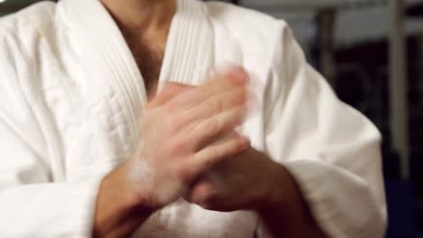 man practicing karate in fitness studio