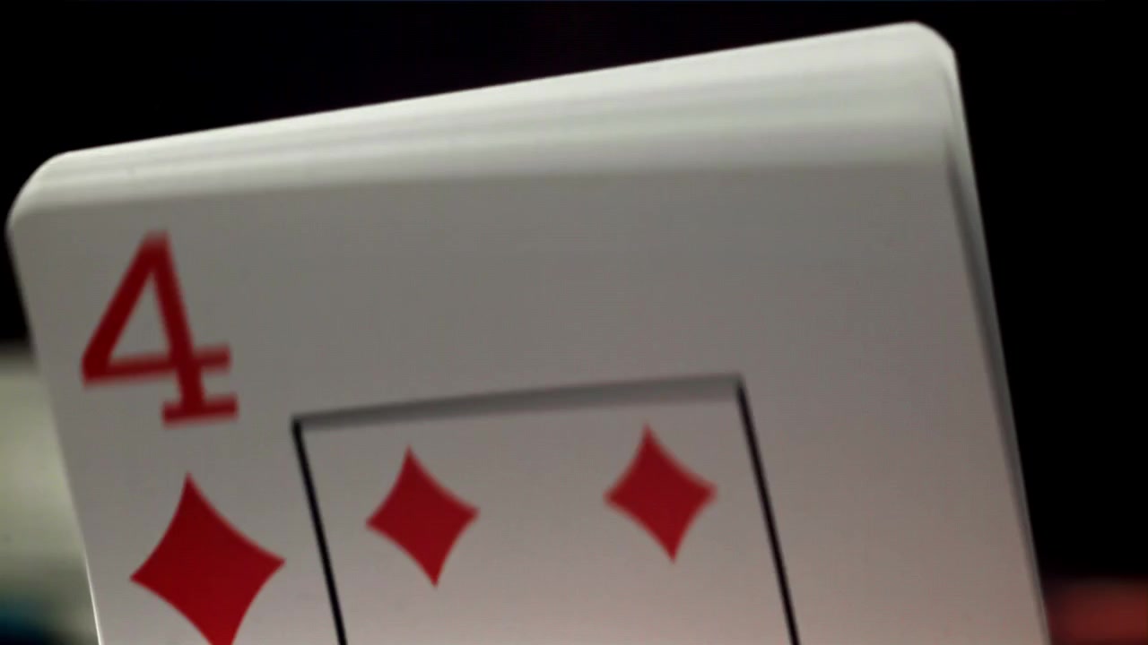 Close-Up View of Playing Cards Being Fanned Out