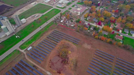 aerial of solar panels in autumn fields highlight the synergy of modern energy and traditional farming, atwater, minnesota, usa