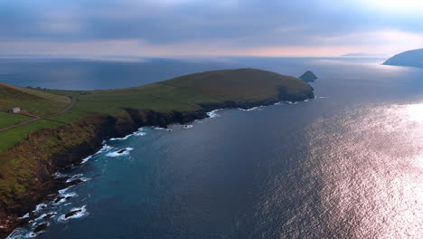 piece of land forming a peninsula-like ledge in the ocean. rocky shores of the northern ireland at the atlantic ocean.