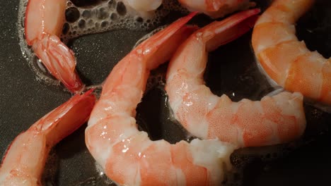 frying shrimp in a pan