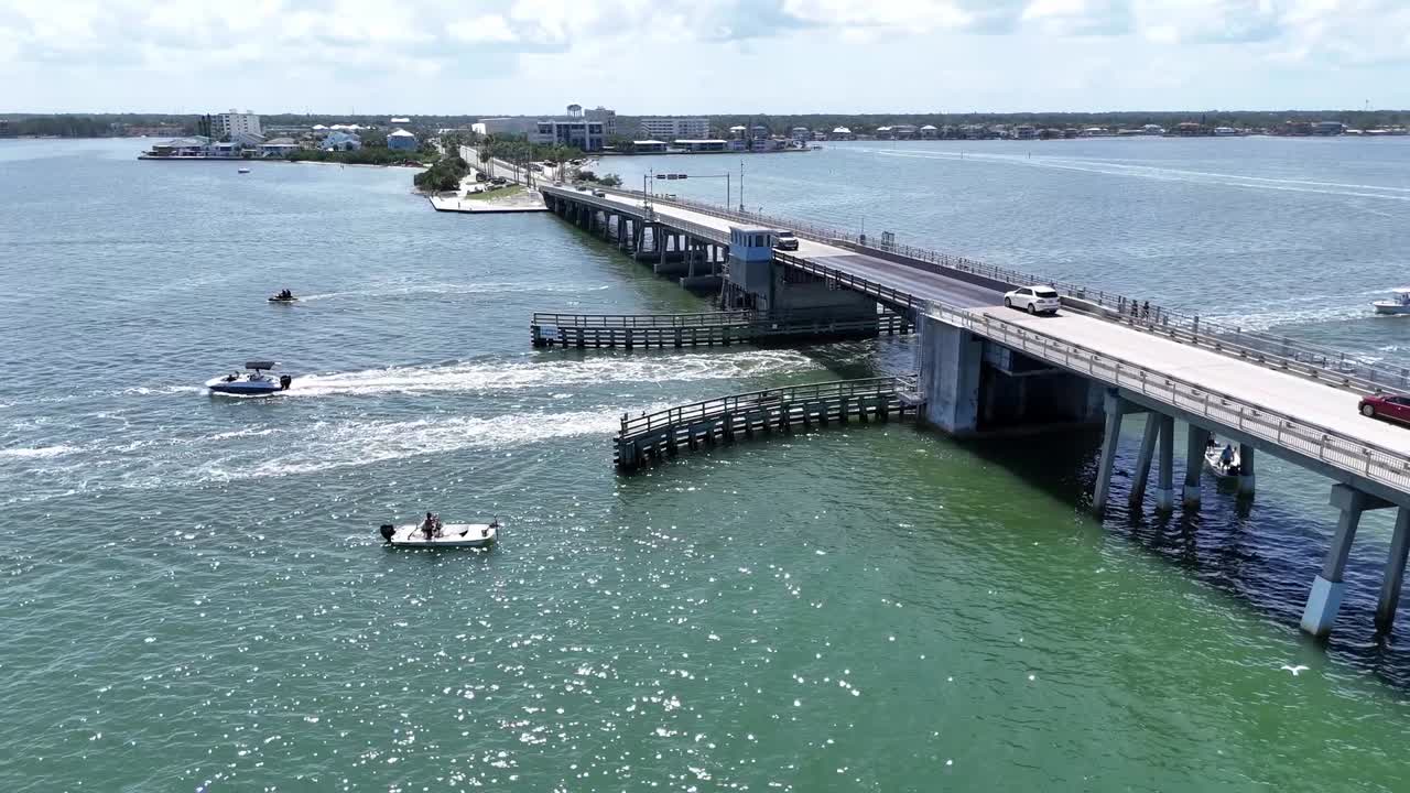 causeway bridge to Honeymoon Island, boats, jetskis and traffic