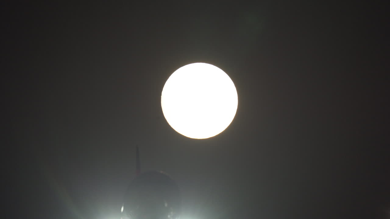 Full Moon Seen from Airplane at Night