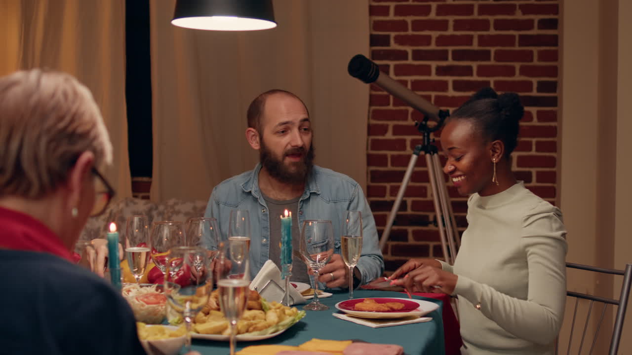 A group of people enjoying dinner together