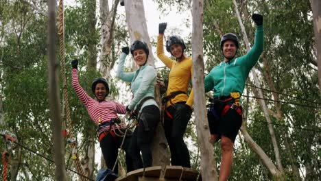 group of woman and trainer walking on the logs 4k