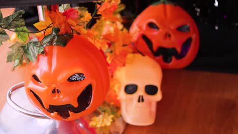 angry looking pumpkins and skulls serving as halloween decorations