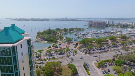 harbor view of traffic passing through downtown sarasota, florida, bayfront park and marina jack