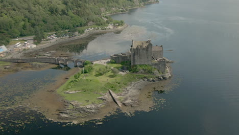 an aerial view of eilean donan castle on a sunny day