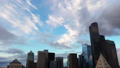 Aerial-rising-above-Smith-Tower-to-show-the-beautiful-blue-sky-filled-with-wispy-clouds