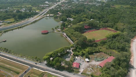 aerial drone view, serian district town ,summer with beautiful green trees,new building and water park lake, water from the mountain sarawak,borneo.